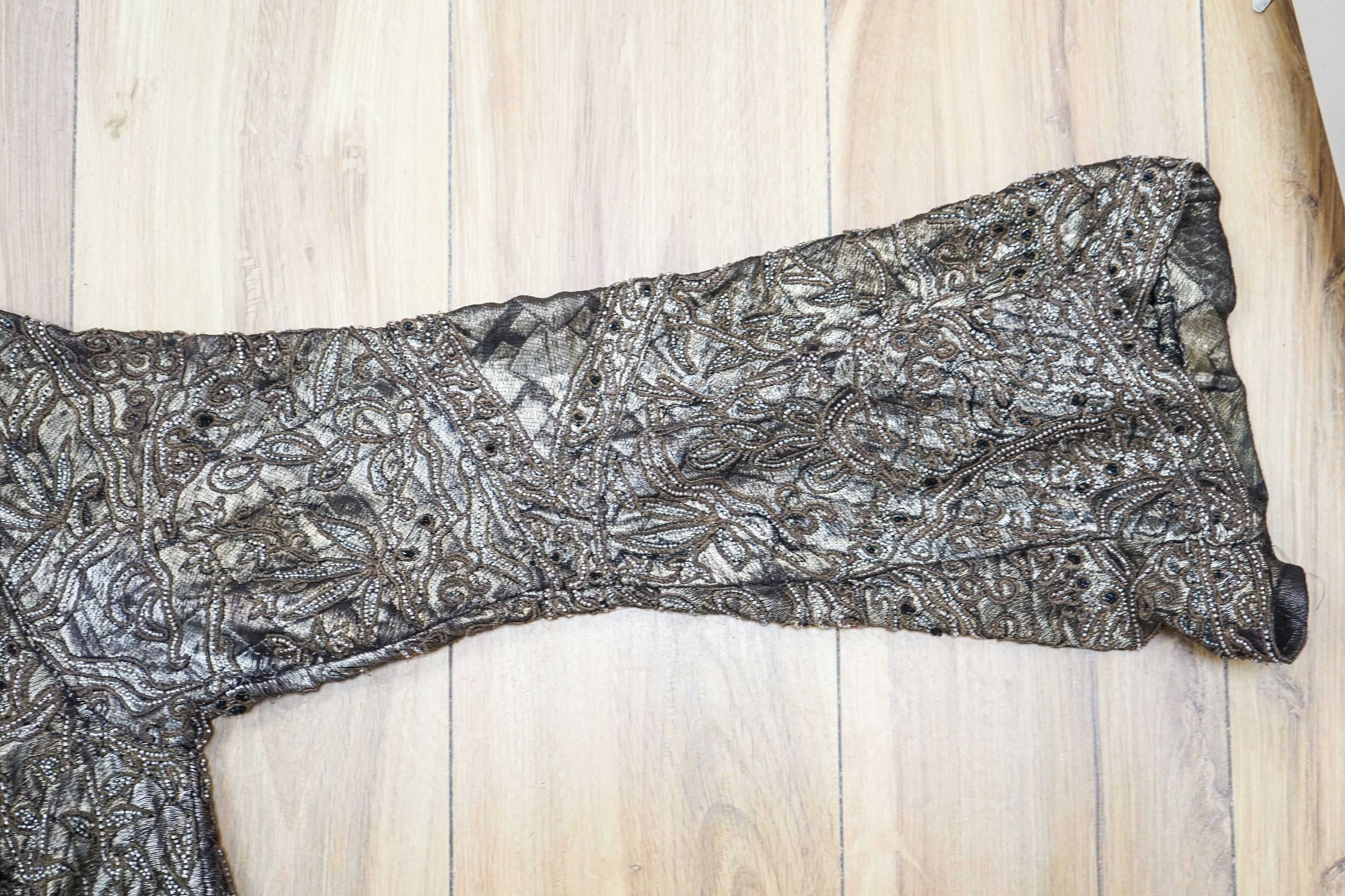 A 1920'3-30's evening bolero jacket in gold lame with silver beading and brown embroidery